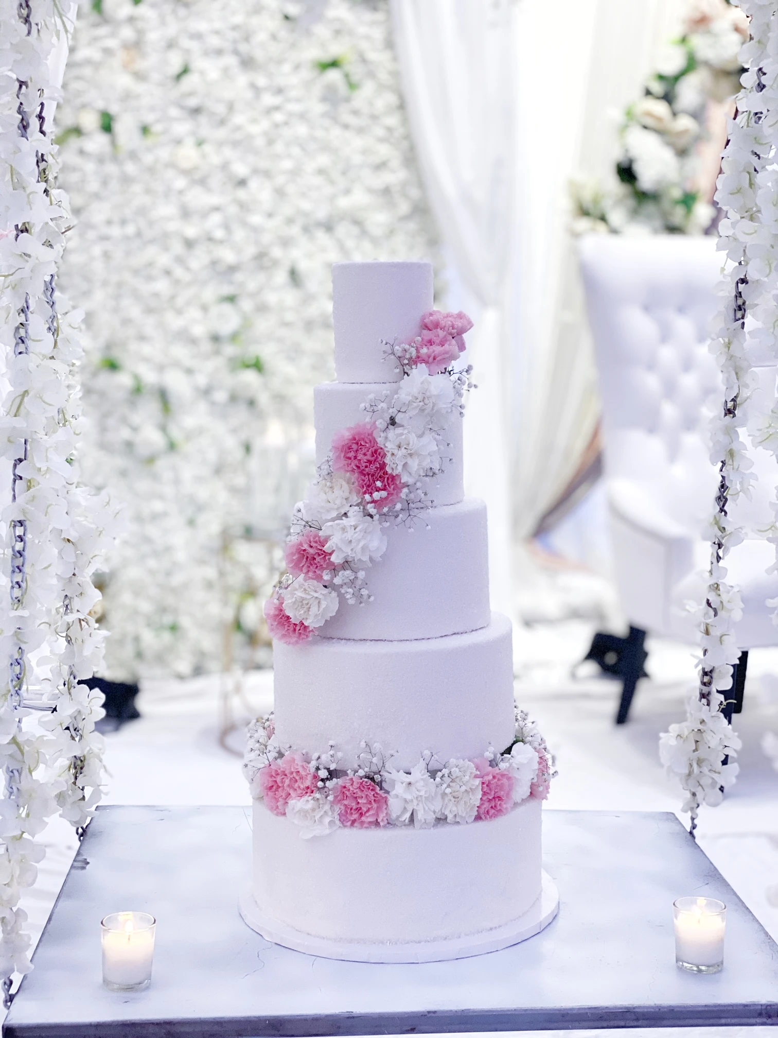 5 tier wedding cake with diagonal and horizontal floral design