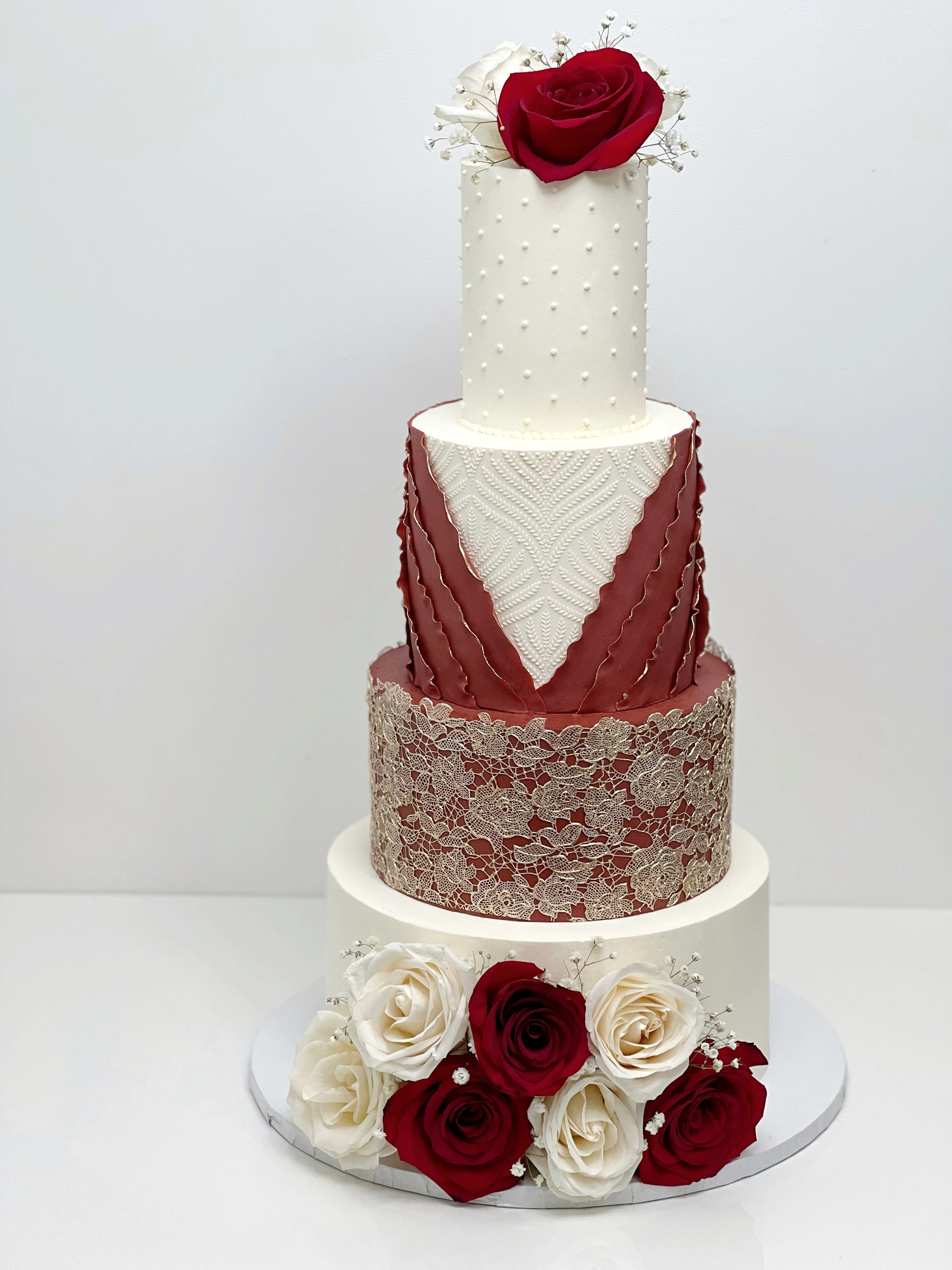4 tier red and gold wedding cake