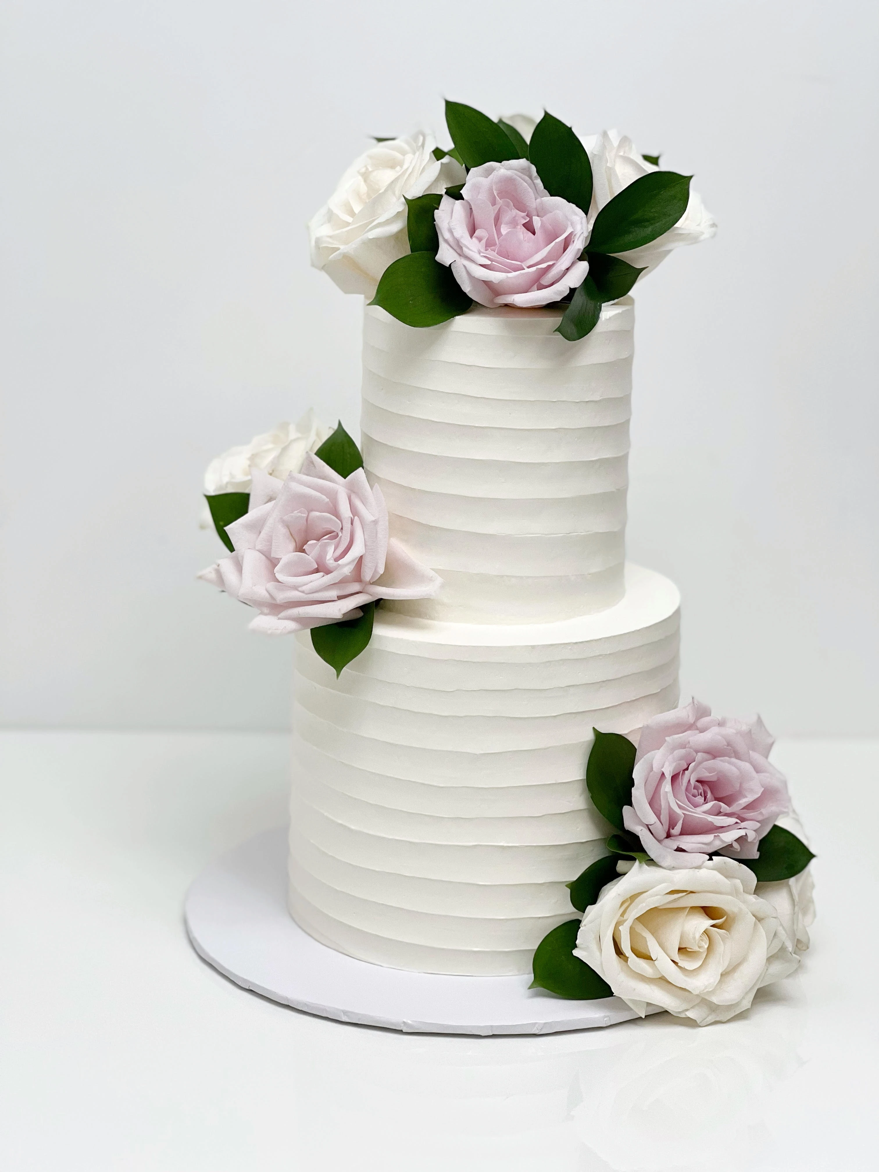 2 tier textured buttercream wedding cake with florals